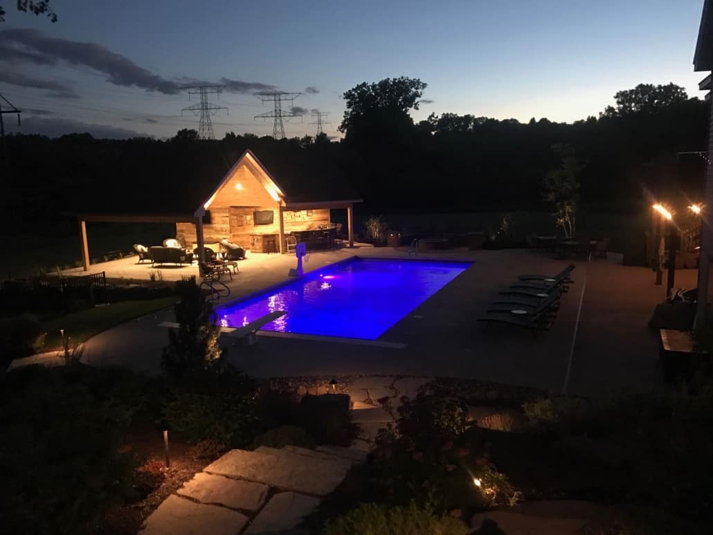 Lighting can highlight your choice in pool materials.