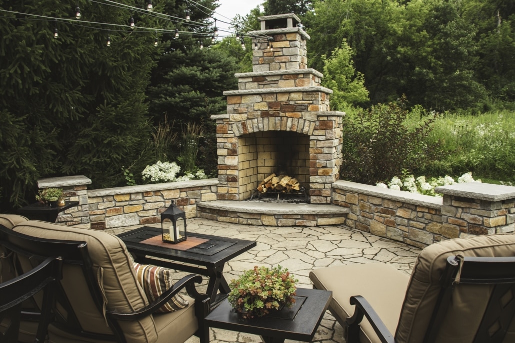 This outdoor fireplace is positioned so that these homeowners and their guests can take in the beautiful background while maintaining their privacy. 