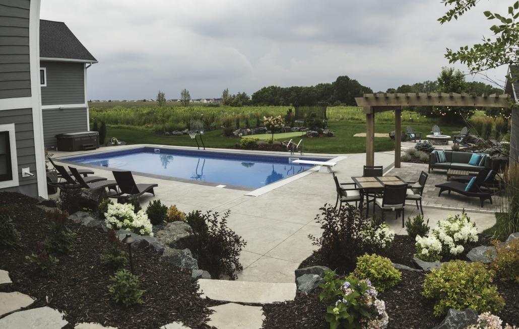 Create a calm centerpiece for your backyard with a pool.