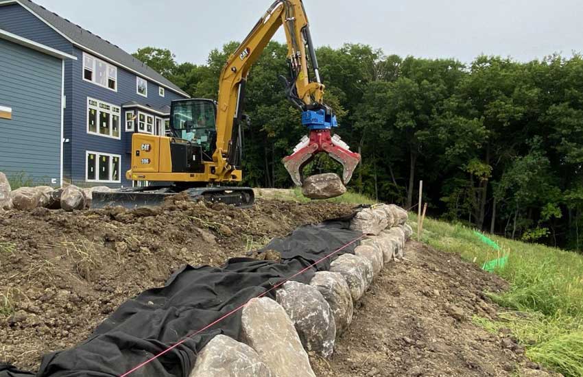 Residential boulder retaining wall landscape