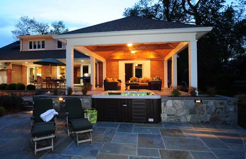 Custom hot tub deck installation by Landscapes Unlimited in Minnesota