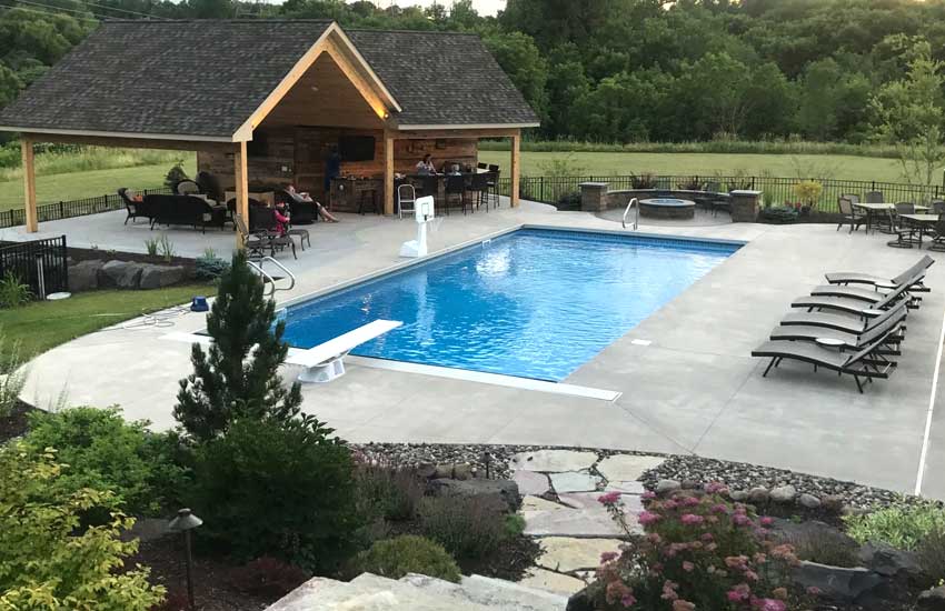 Custom outdoor pool installation by Landscapes Unlimited in Minnesota