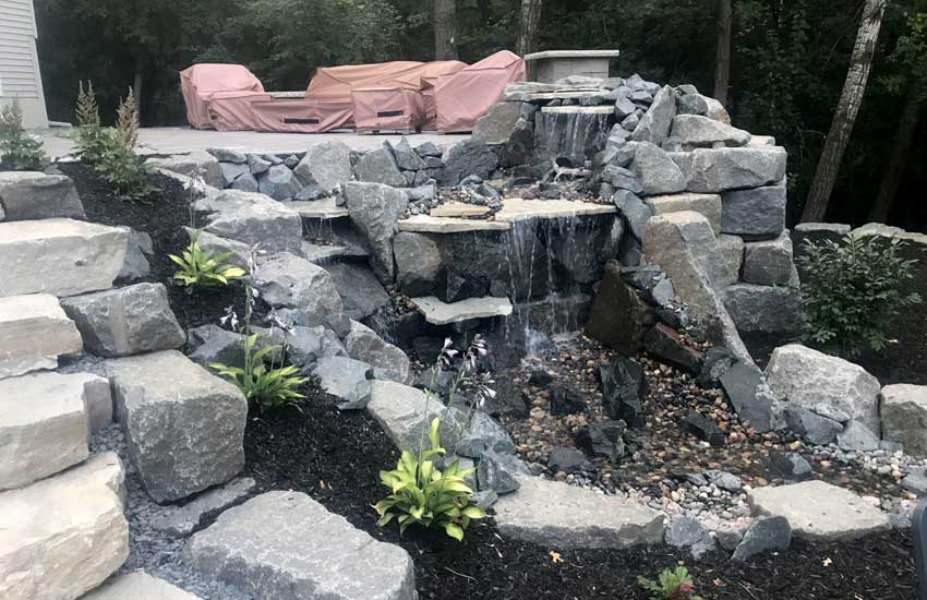 Waterfall water feature by Landscapes Unlimited