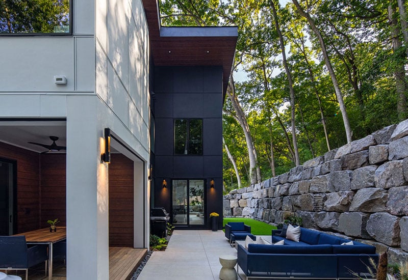 Large retaining wall in a backyard of a modern home
