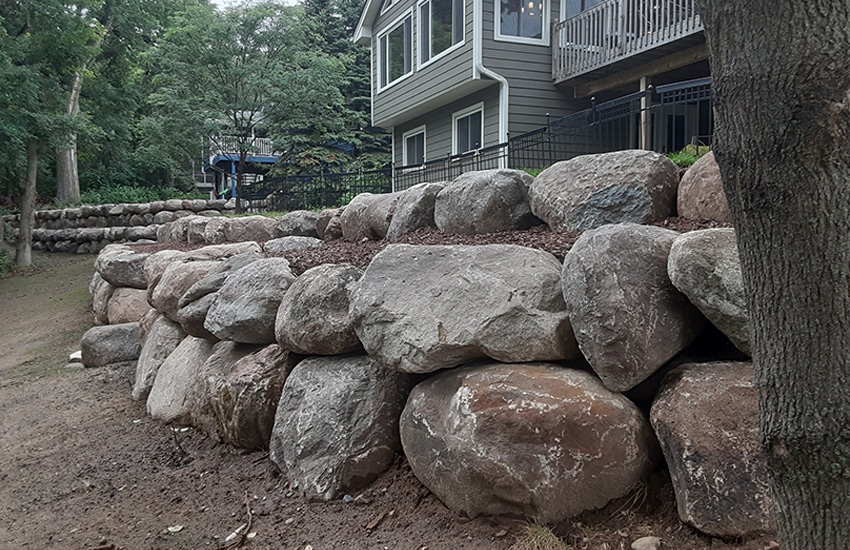 Boulder retaining wall installation Minnesota
