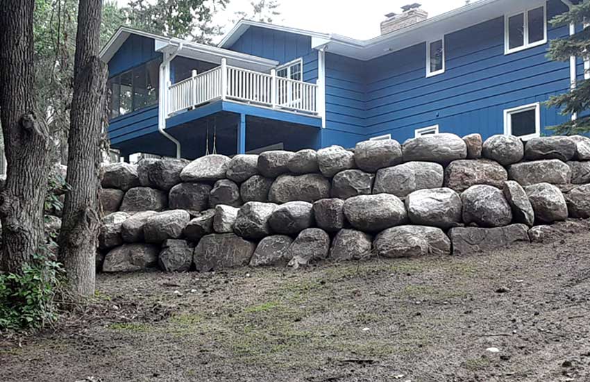 Completed boulder retaining wall by Landscapes Unlimited