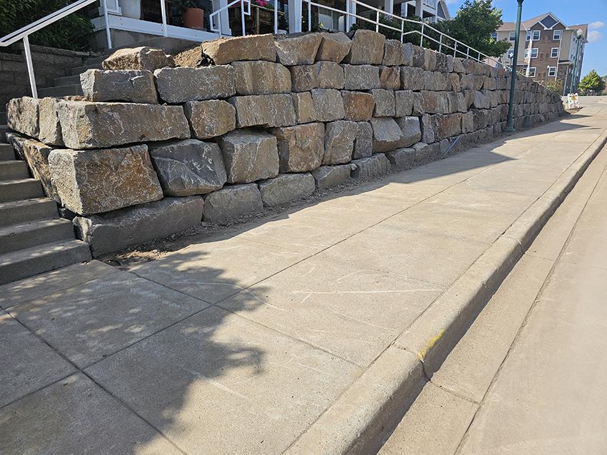 Commercial granite boulder retaining wall at senior living property Minnesota