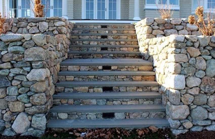 Completed fieldstone retaining wall by Landscapes Unlimited