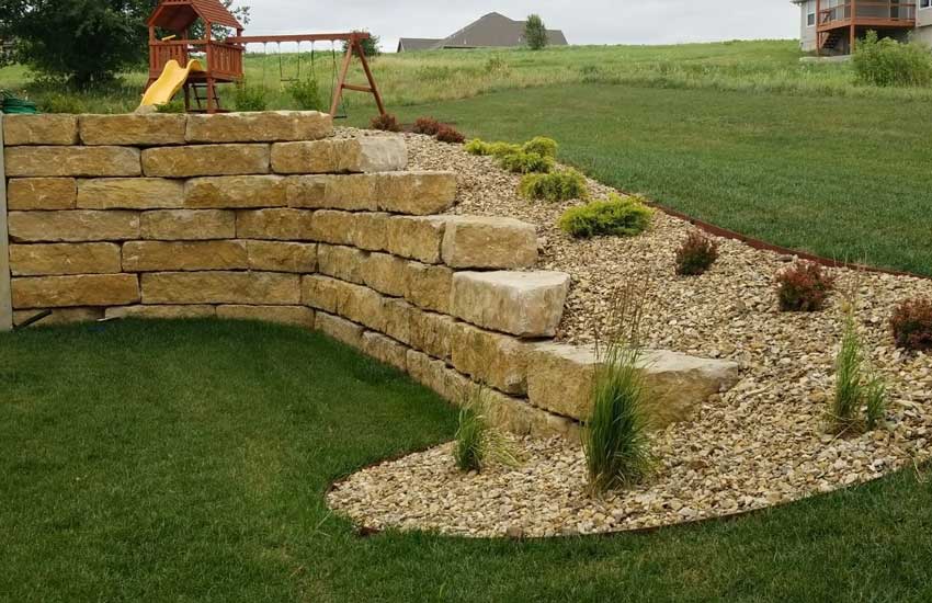 Residential limestone retaining wall landscape