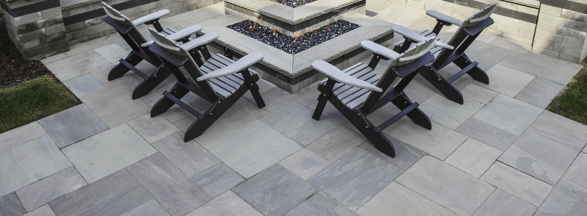 Custom paver patio installation in Minnesota by Landscapes Unlimited