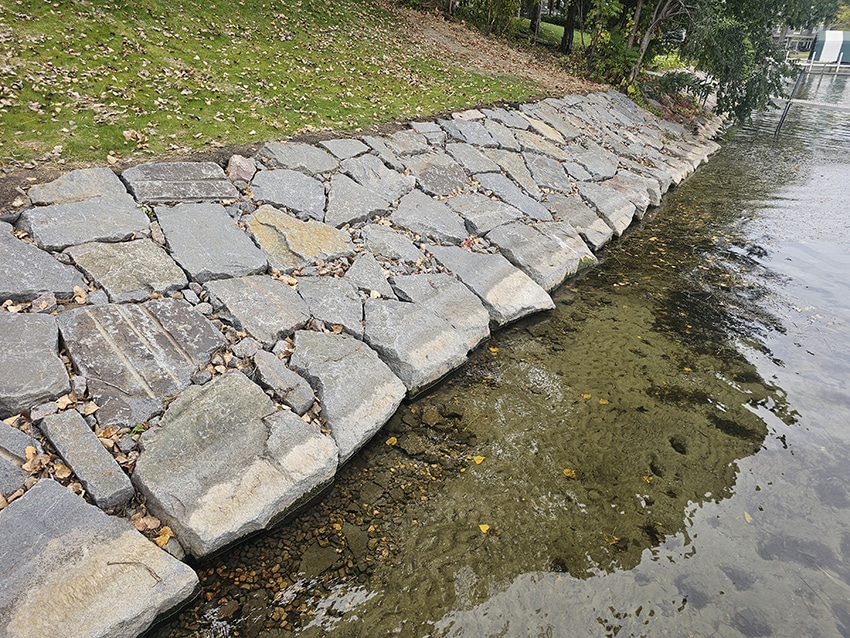 Flagstone and natural stone shoreline stabilization along a lakefront bank in Orono, MN